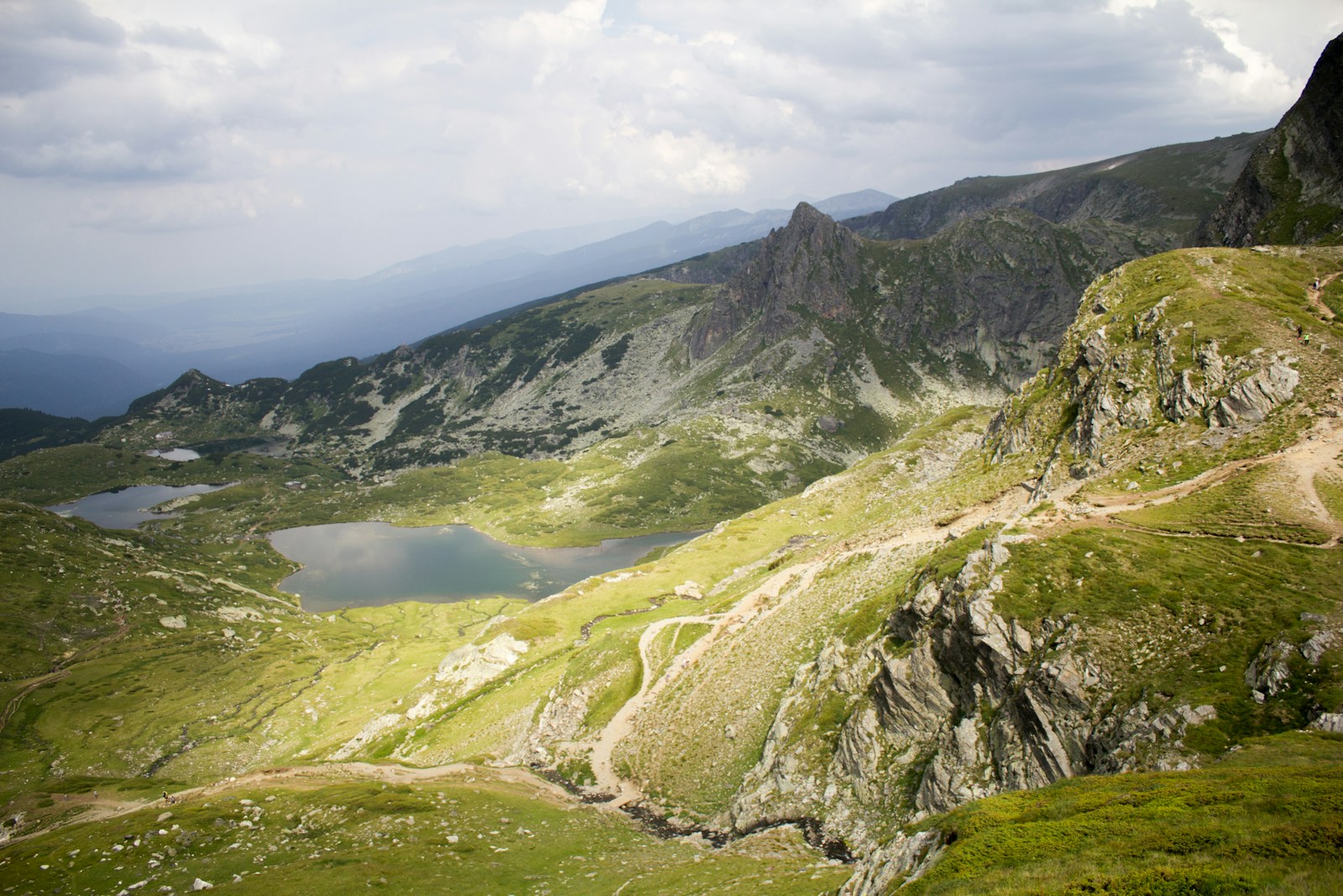 A Quiet Revolution Beneath Our Feet: Europe’s Natura 2000 and the Fight to Save Nature 1 a view of a mountain with a lake in the middle of it
